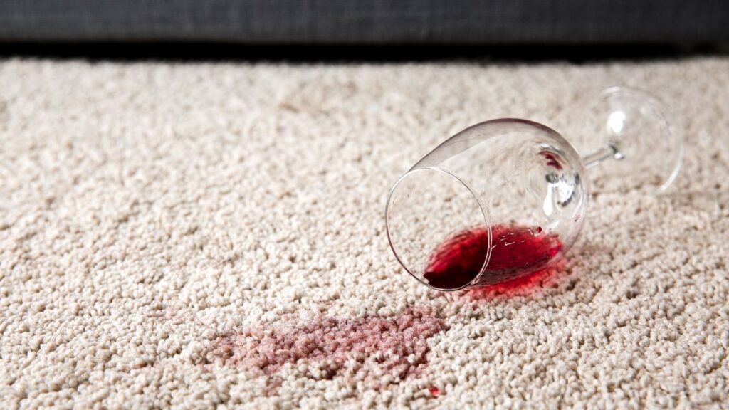 spilled wine on beige carpet