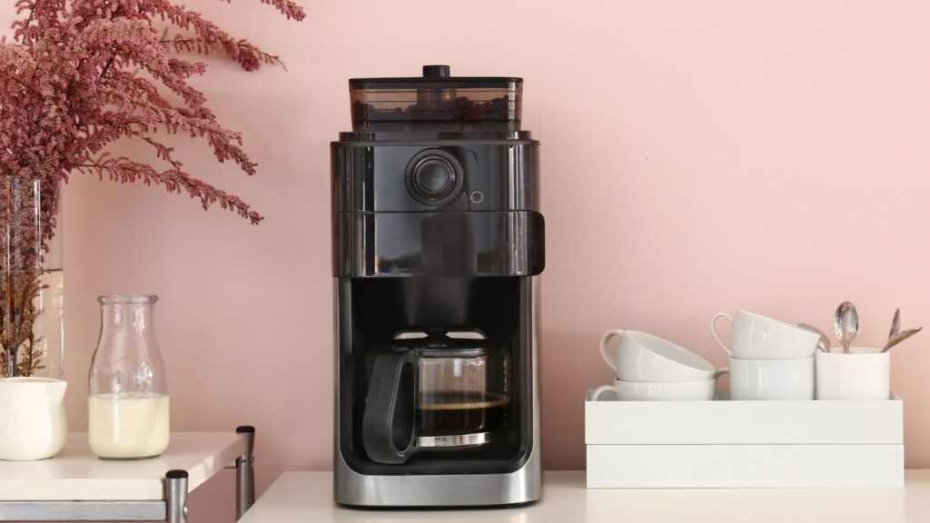 coffee machine on a pink background