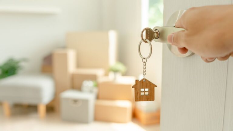 key with house keychain in a door