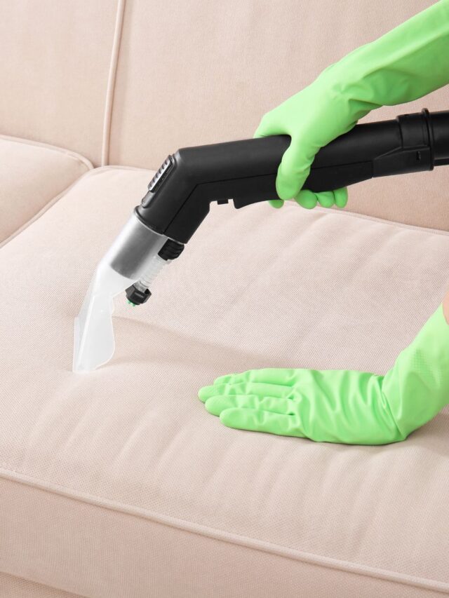 vaccuming-fabric-couch-green-cleaning-gloves