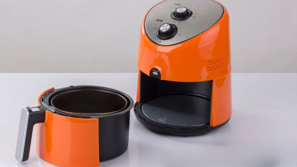 orange air fryer with basket out