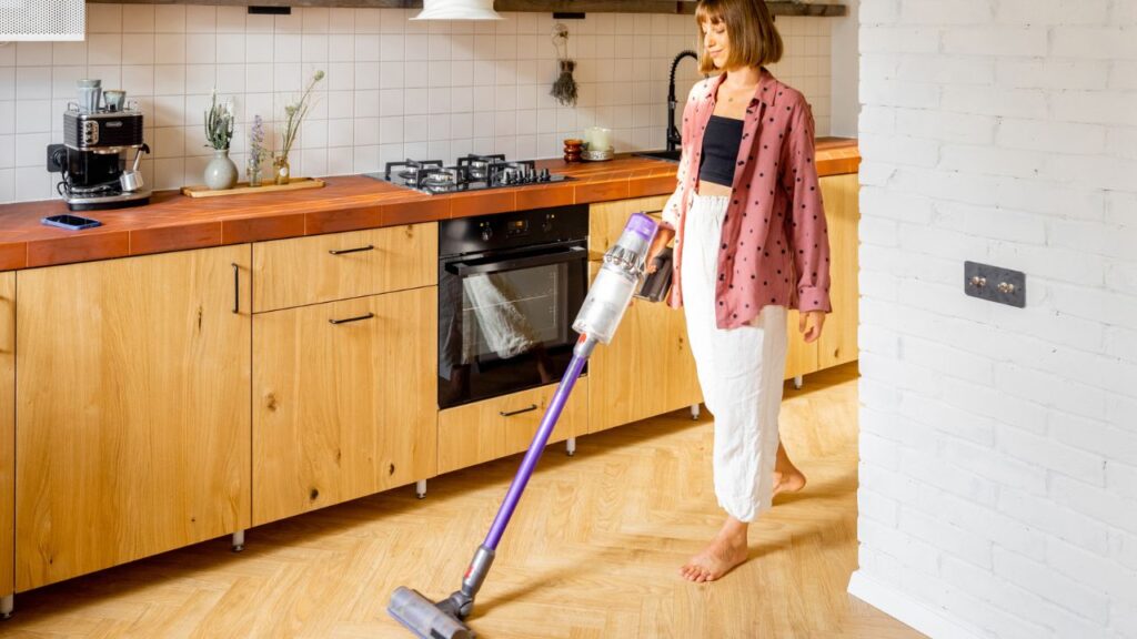 vaccuming kitchen wooden floors