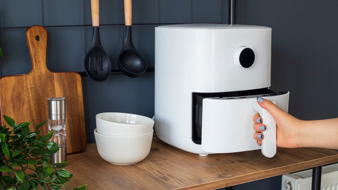 white air fryer blue kitchen wall