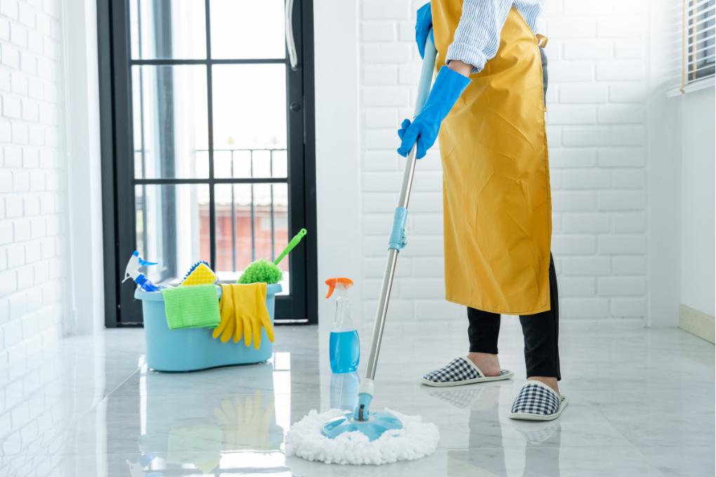 person cleaning with a mop