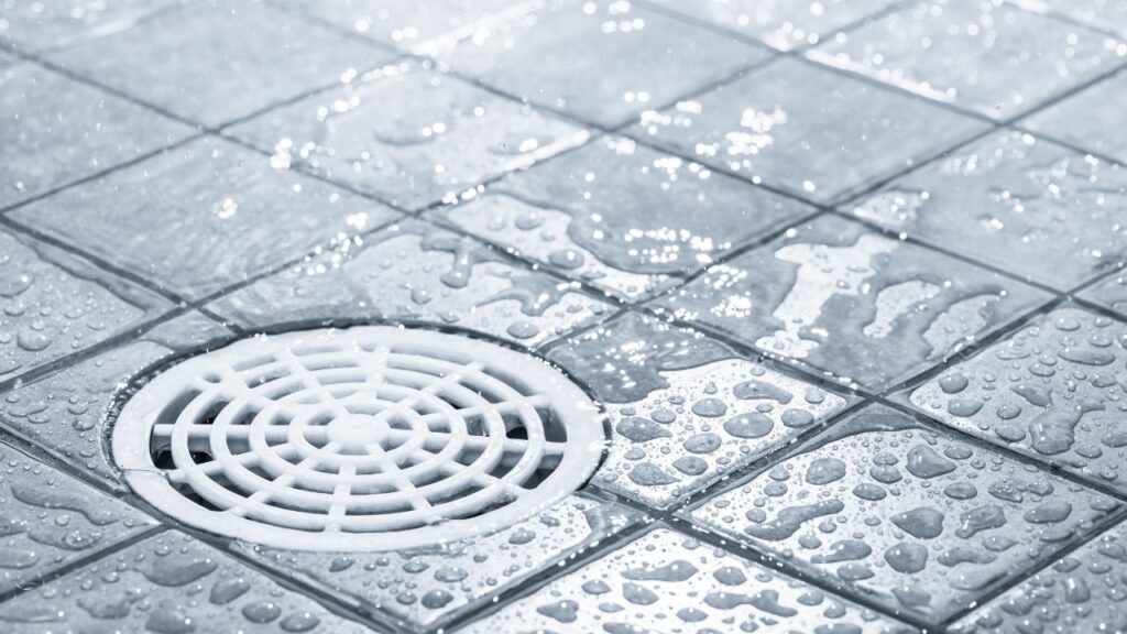 shower-floor-drain-with-droplets-of-water