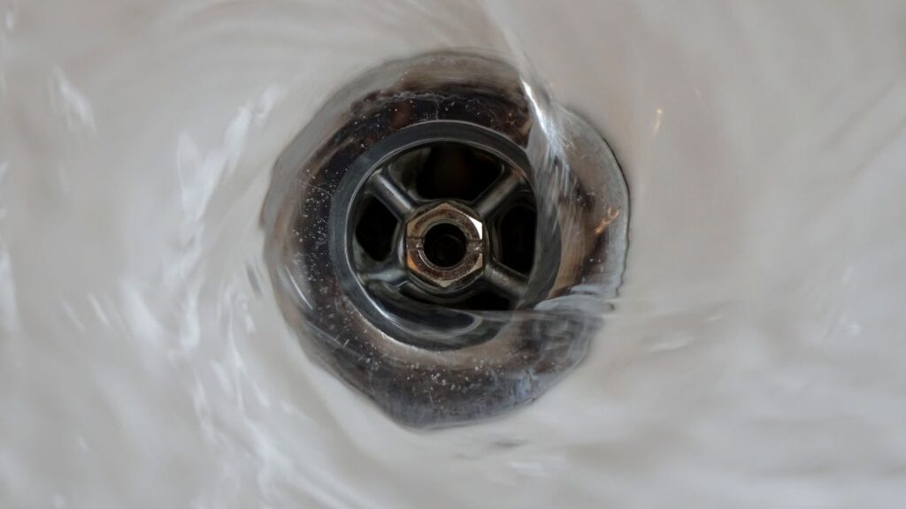 water flowing through sink drain